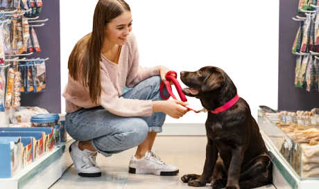 asian girl with dog sitting inside retail store